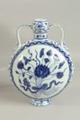 A CHINESE BLUE AND WHITE TWIN-HANDLE MOON FLASK. 28.5cms high.