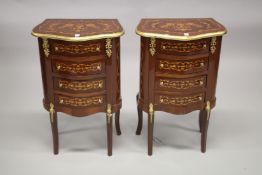 A PAIR OF LOUIS XVI STYLE FOUR DRAWER INLAID BEDSIDE CABINETS on curving legs. 76cms high x 48cms