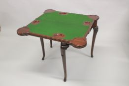 A GEORGE III IRISH MAHOGANY COMBINATION FOLD-OVER TEA AND GAMES TABLE, of shaped outline with