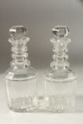 A GOOD PAIR OF MALLET DECANTERS AND STOPPERS.