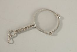 A PLATINUM AND DIAMOND LORGNETTE.