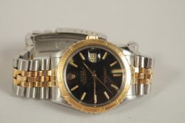 A GENTLEMAN'S STEEL AND GOLD TURNOGRAPHY WRISTWATCH. Stamped A55.