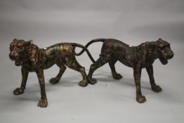 A LARGE LIFE SIZE PAIR OF BRONZE TIGERS. 123cms long x 67cms high.