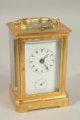A VERY GOOD 19TH CENTURY FRENCH REPEATER BRASS CARRIAGE CLOCK with alarm, in an engraved case. 14.