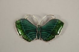 A SILVER ENAMEL BUTTERFLY BROOCH.