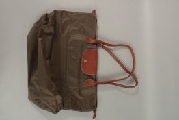A LONGCHAMP FOLDING BAG.