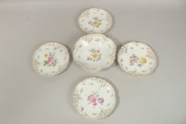 A SET OF FOUR ROYAL NYMPHENBURG PORCELAIN PLATES and A BOWL painted with flowers (5).