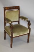 A GOOD MAHOGANY ELBOW CHAIR, early 20th Century, with floral carved cresting rail, upholstered back,