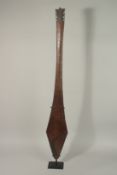 A PALM WOOD PADDLE, 114cms long.