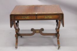 A GOOD REGENCY ROSEWOOD SOFA TABLE in the manner of GEORGE BULLOCK, with crossbanded top, brass