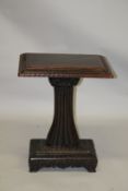 AN ANGLO INDIAN PADOUK PEDESTAL TABLE, late 19th Century, with a lapette carved rectangular top,