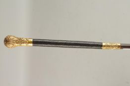 A GOOD VICTORIAN HANDLED WALKING CANE with leather top and embossed handle. 97cms long.