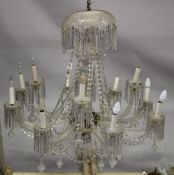 A GOOD LARGE CUT GLASS TWELVE BRANCH, TWO-TIER CHANDELIER with cut glass prisms and drops. 3ft