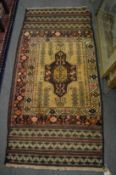 A BELOUCH RUG, 163cm x 77cm.