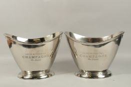A PAIR OF OVAL CHAMPAGNE COOLERS. 34cms wide.