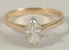 A CERTIFICATED 14CT YELLOW AND WHITE GOLD MARQUISE-CUT DIAMOND SOLITAIRE RING. Diamond 0.60ct. Cert.