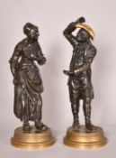 Mid-19th Century Italian School, Punchinello and a female companion, cast bronze, Punchinello with a