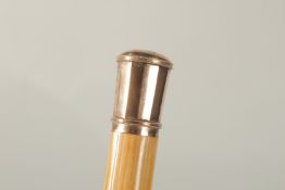 A PRESENTATION CANE in a folding leather and silk lined case with gold on handle. 97cms long. 1475.