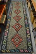 A KILIM RUNNER, 300cm x 83cm.