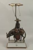 A LAMP AS A CHINESE MAN ON A DONKEY, standing on a mirrored base.