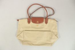 A LONGCHAMP FOLDING BAG.