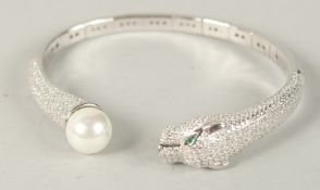 A SILVER PANTHER PEARL SET BRACELET.