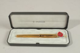 A PARKER PEN.