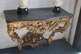 A SUPERB NEAR PAIR OF 18TH CENTURY SERPENTINE FRONTED CONSOLE TABLES with marble tops, the front