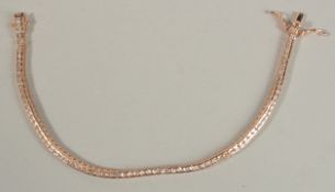 A ROSE GOLD-PLATED SILVER ARTICULATED BRACELET semi-rubover set with princess-cut white cubic