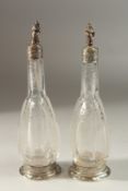 A VERY GOOD PAIR OF CONTINENTAL, POSSIBLY GERMAN, CRYSTAL GLASS AND SILVER MOUNTED SCENT BOTTLES AND