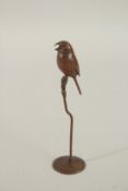 A JAPANESE BRONZE BIRD IN A TREE. 16cms high.