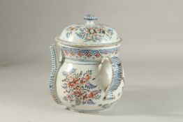 A VERY FINE 18TH CENTURY BRISTOL DELFT POSSET POT AND COVER, painted with flowers in mainly blue,