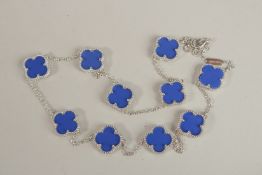 A SILVER CLOVER NECKLACE.