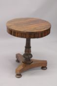 A GOOD LATE REGENCY ROSEWOOD CIRCULAR SMALL DRUM TABLE with figured top, centre column support and