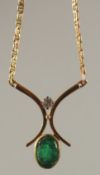 AN 18CT YELLOW GOLD, DIAMOND AND EMERALD PENDANT with 18ct yellow gold chain.