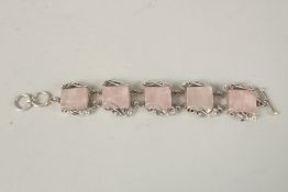 A CHUNKY SILVER ROSE QUARTZ BRACELET.