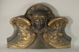 A VERY GOOD 18TH CENTURY CARVED WOOD, PAINTED AND GILDED DOOR ARCH, carved as a female mask and