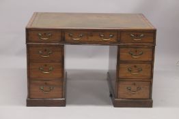 A GOOD GEORGE III MAHOGANY PARTNERS DESK, Dated 1801, with inset leather top, the top with two dummy
