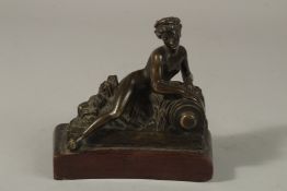 A 19TH CENTURY BRONZE OF A CLASSICAL YOUNG LADY on a chaise longue. 10cms high.