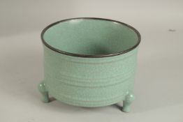 A CHINESE CELADON TRIPOD CENSER. 18cms diameter.