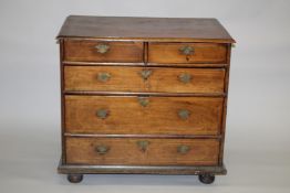 AN 18TH CENTURY WALNUT CHEST OF DRAWERS, with two short and three long graduated drawers, having