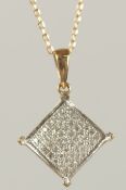 A 9CT GOLD DIAMOND PENDANT ON A CHAIN.