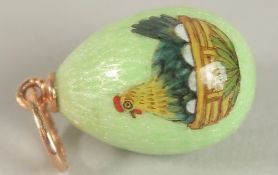 A 14CT GOLD YELLOW EGG PENDANT.