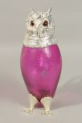 A GOOD RUBY GLASS AND PLATE NOVELTY OWL CLARET JUG with carrying handle, on claw feet. 29cms high.
