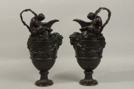 AFTER CLODION A SUPERB PAIR OF CLASSICAL BRONZE EWERS with Satyr figure handles, rams masks and