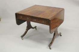 A REGENCY MAHOGANY AND ROSEWOOD BANDED SOFA TABLE, with a pair of small frieze drawers, dummy