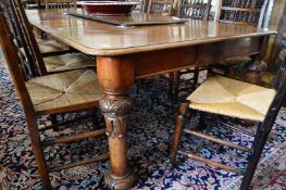 A GOOD VICTORIAN MAHOGANY PULL-OUT DINING TABLE WITH THREE LEAVES on carved and turned legs. 8ft