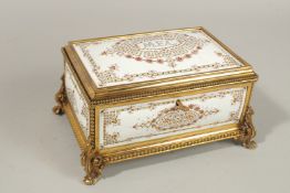 A SUPERB FRENCH WHITE ENAMEL VANITY BOX with gilt mounts and acanthus feet. 23cms long x 15cms