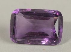 A SINGLE UNMOUNTED RECTANGULAR 6.20CT AMETHYST, boxed.