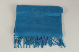 A LARGE BLUE BURBERRY CASHMERE SCARF.